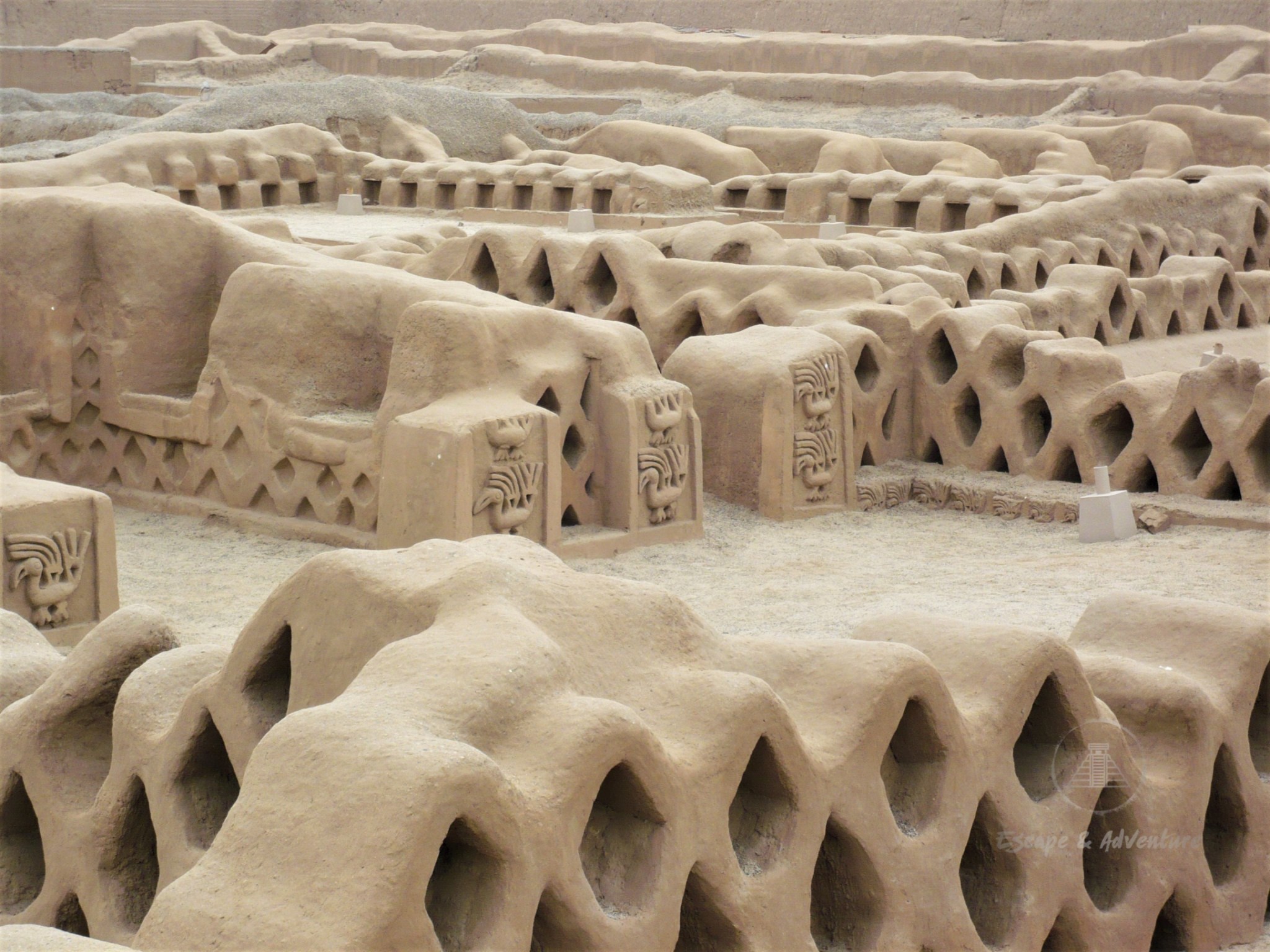 Close-up of sand-coloured ruins at Chan Chan Archaeological Zone, Peru. 